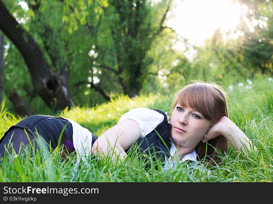 Single beautiful woman relaxing at the park. Single beautiful woman relaxing at the park