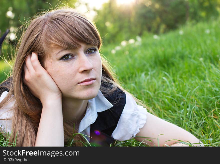 Single beautiful woman relaxing at the park. Single beautiful woman relaxing at the park