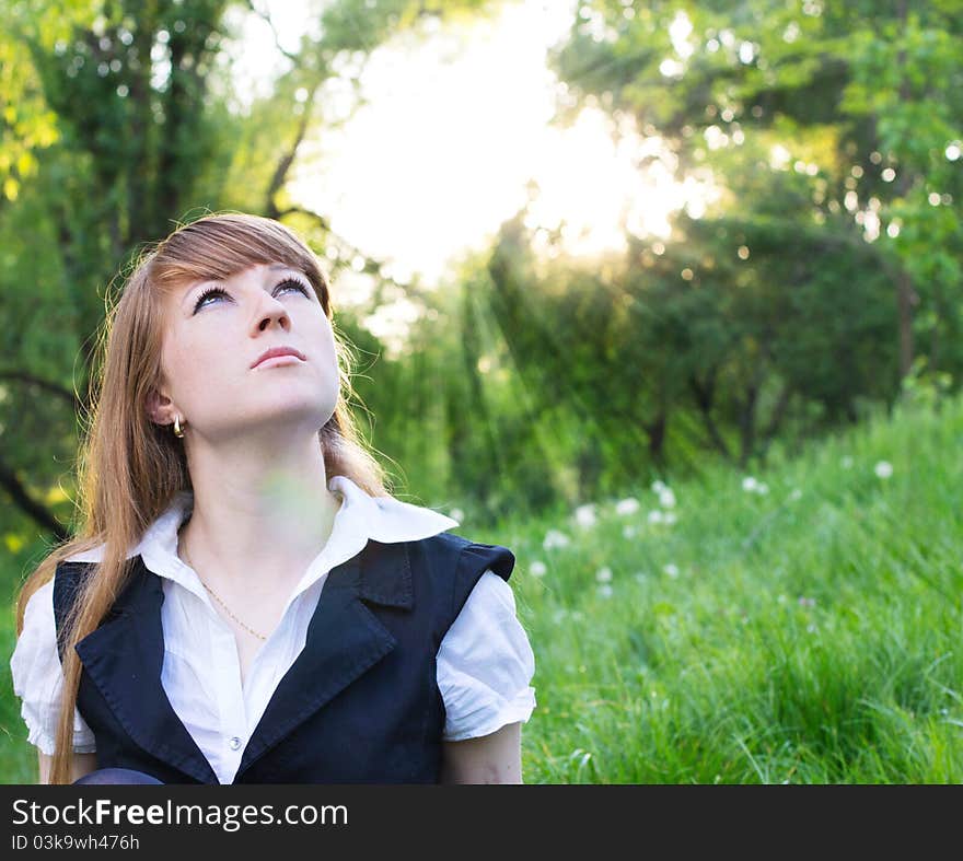 Young woman relaxing at the park. Young woman relaxing at the park