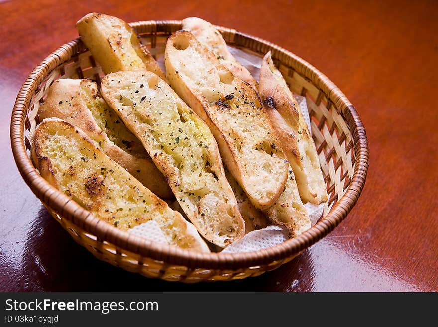 Fresh baked sliced herb and garlic roll from the oven. Fresh baked sliced herb and garlic roll from the oven.