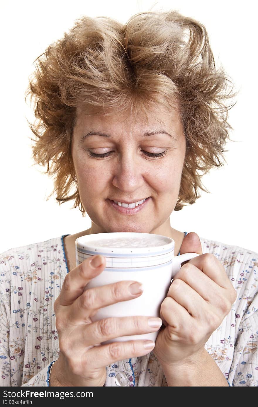 Woman waking up with a coffee (Looking at coffee)