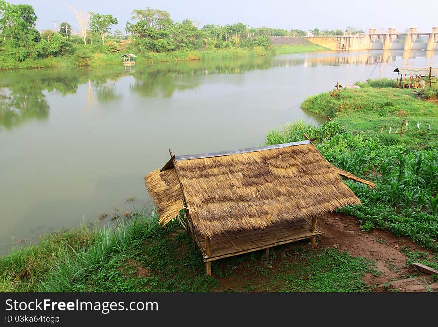 Bamboo hut on riverside and reservoir. Bamboo hut on riverside and reservoir.