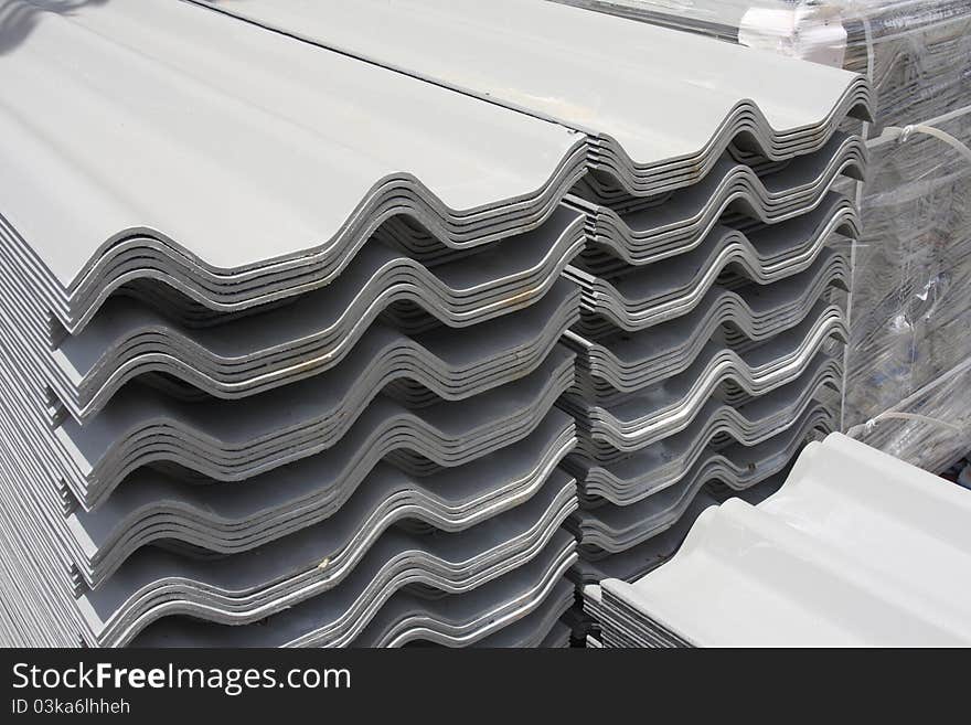 Pile up of roof tiles in construction warehouse. Pile up of roof tiles in construction warehouse