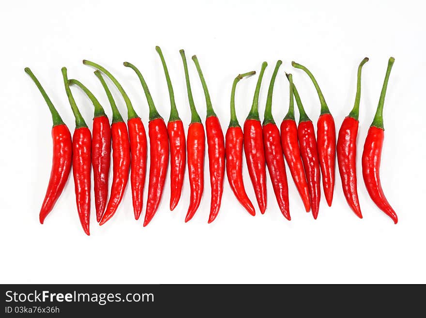 Fresh Red chili peppers on a white background