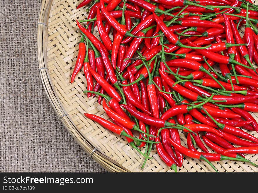 Fresh Red chili peppers on bamboo weave