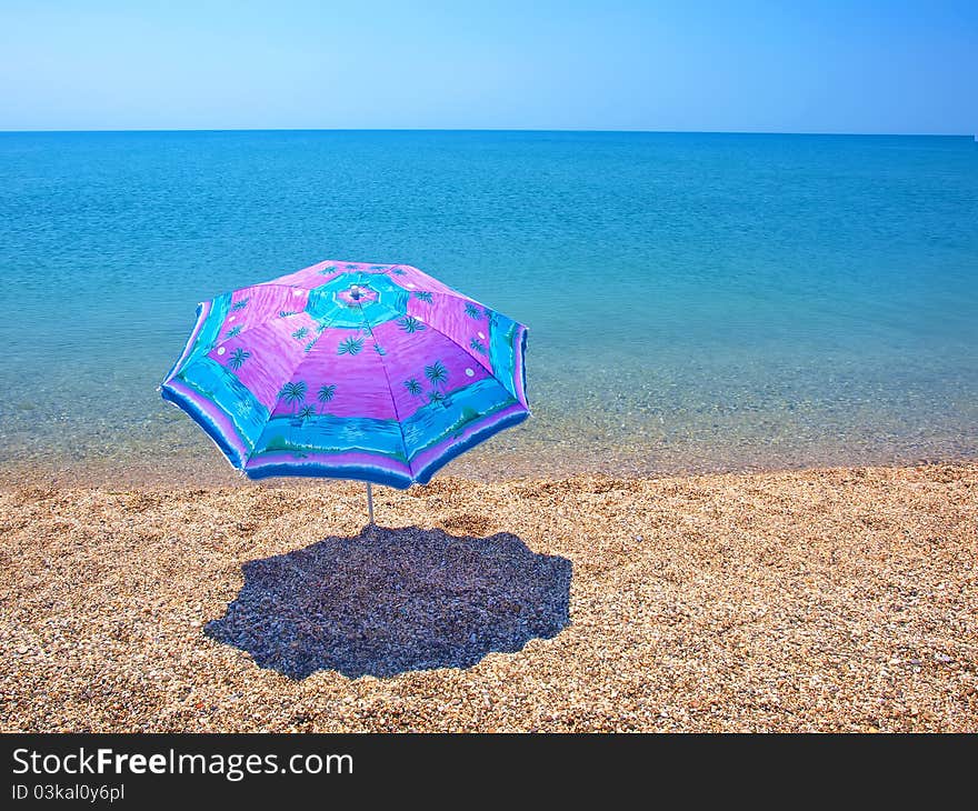 Beach umbrella, sea and sky