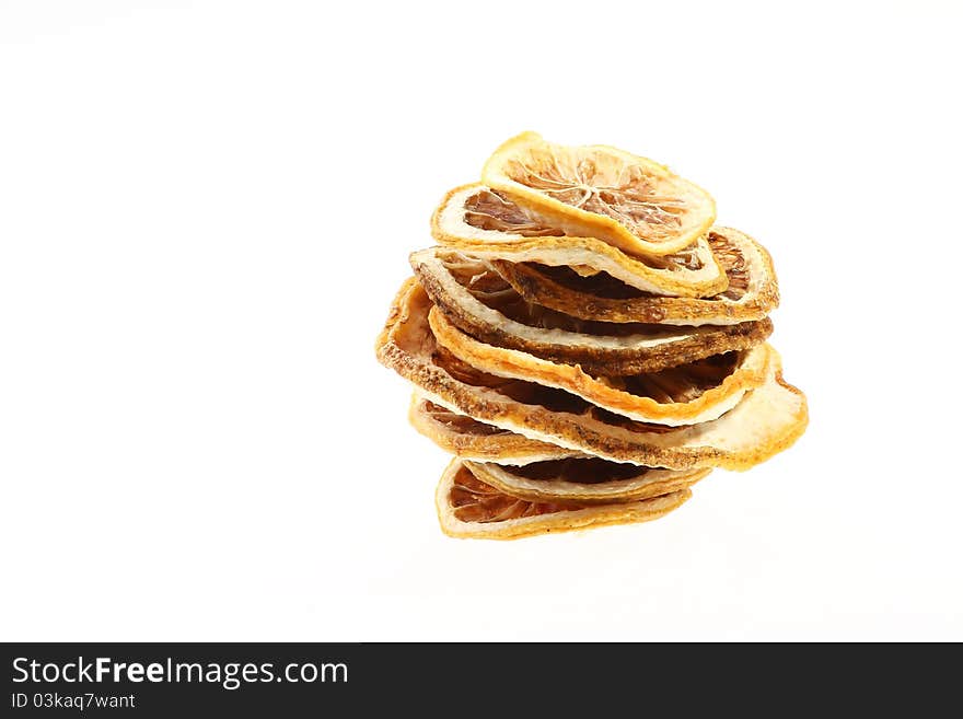 Desiccated citrus slice on white background. Desiccated citrus slice on white background