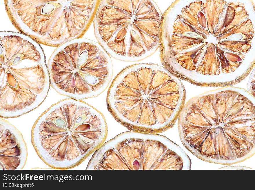 Desiccated citrus slice on white background. Desiccated citrus slice on white background