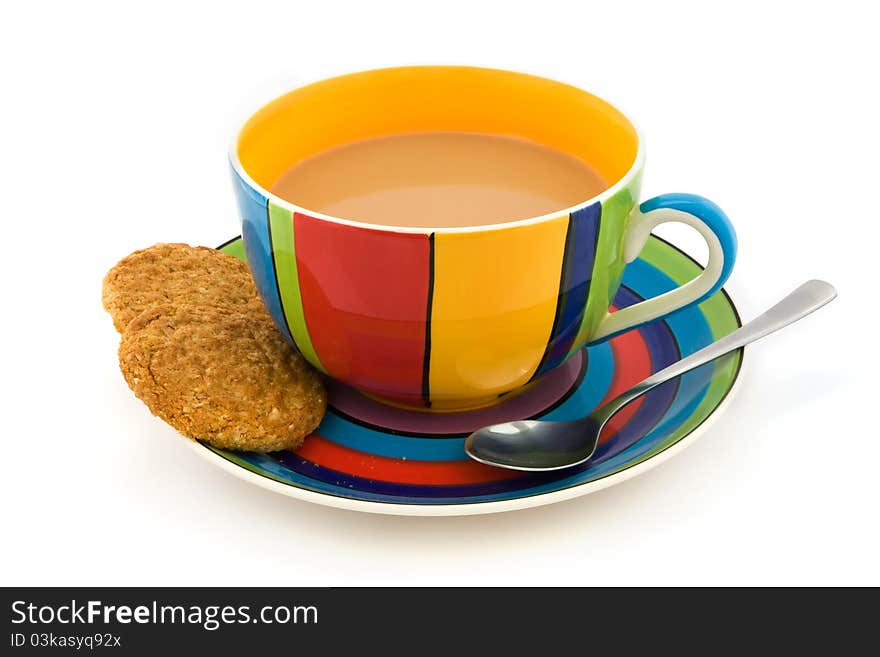 Stripy cup and saucer with two biscuits isolated on white. Stripy cup and saucer with two biscuits isolated on white