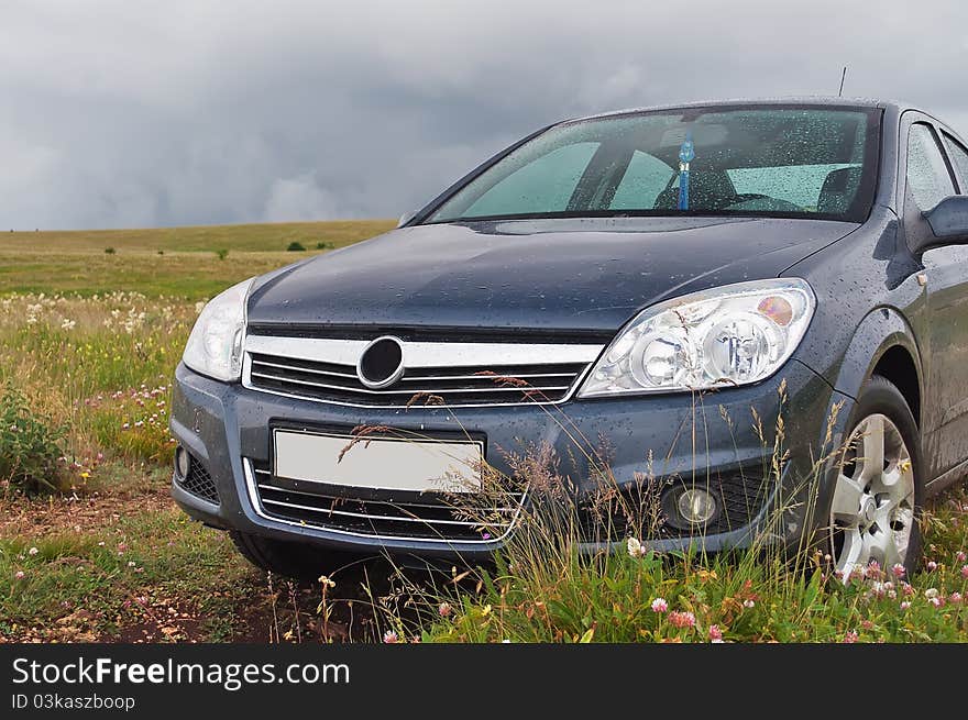 Car on the grass after the rain in Crimeam mountains. Car on the grass after the rain in Crimeam mountains