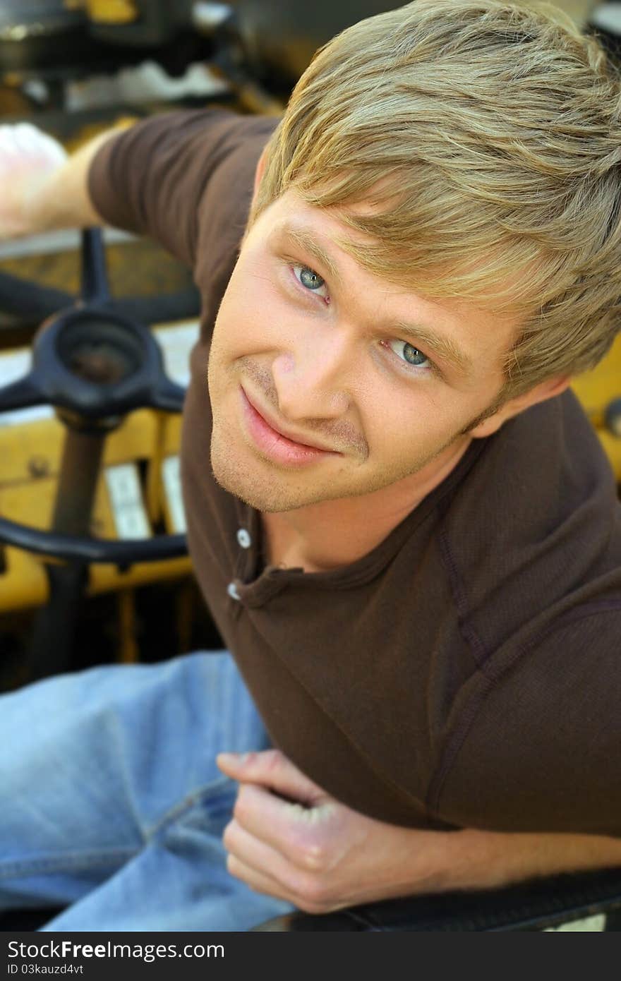 Closeup portrait of a smiling happy young guy learning in. Closeup portrait of a smiling happy young guy learning in