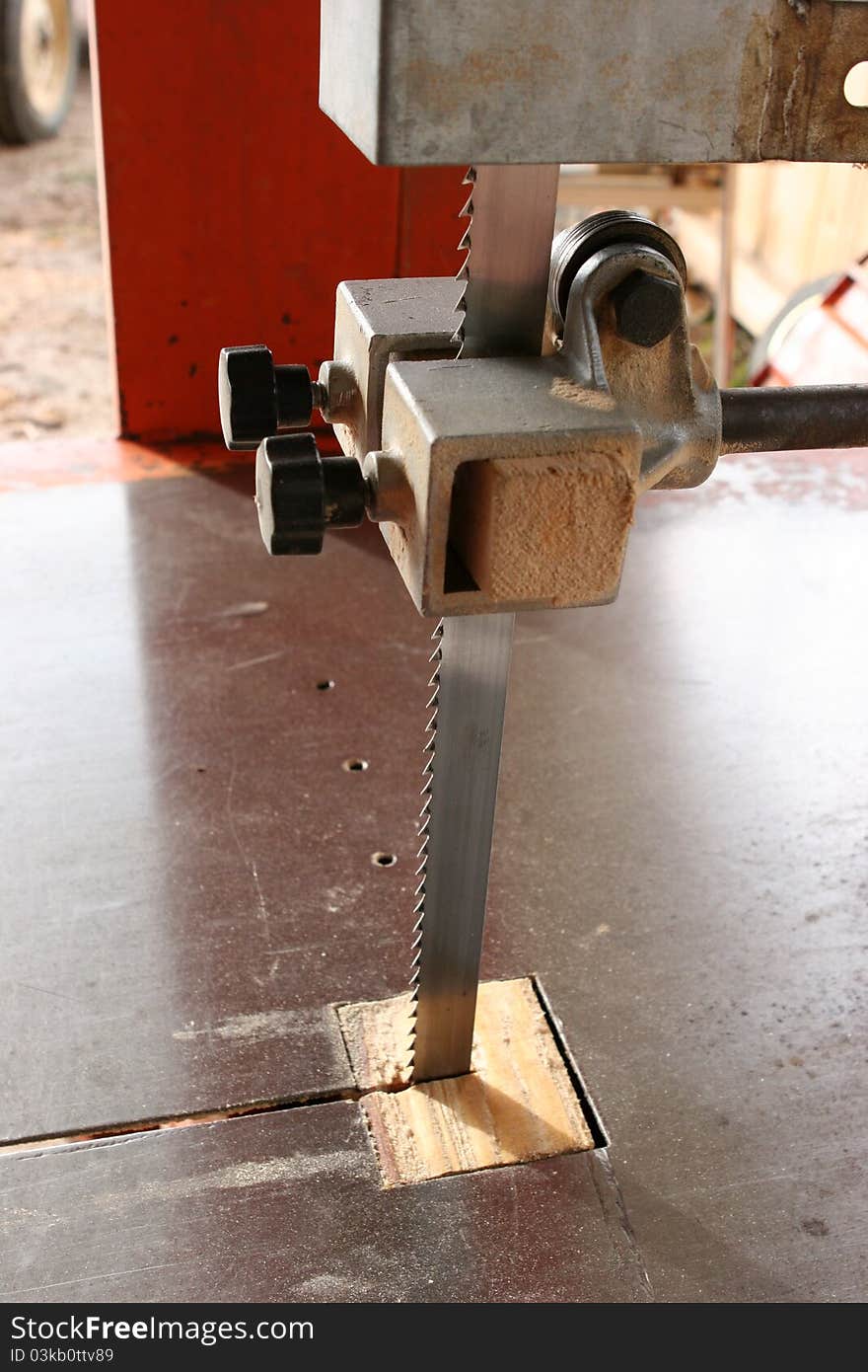 Man cutting a log of wood