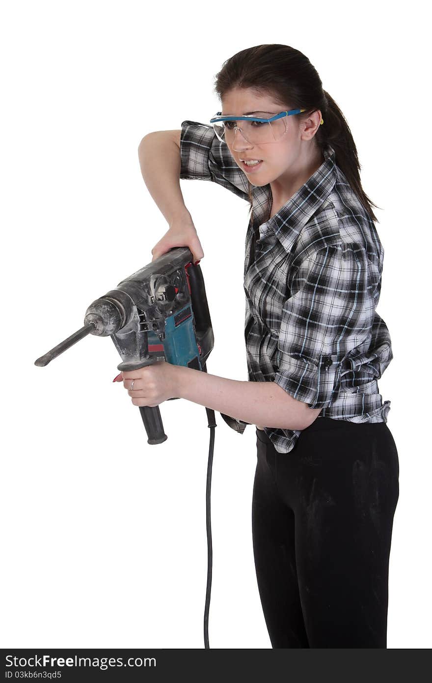 Young girl in a glasses hold a perforator. Young girl in a glasses hold a perforator