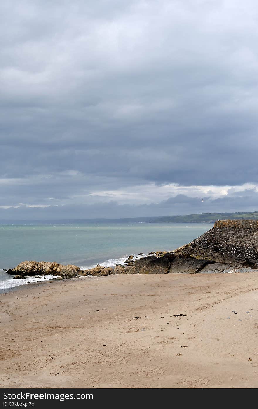 New Quay beach at low tide, looking noth to AberaeronWest Wales, united Kingdom. New Quay beach at low tide, looking noth to AberaeronWest Wales, united Kingdom