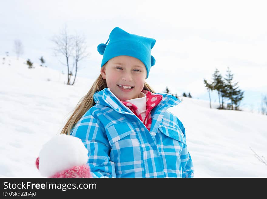 7 Year Old Girl On Winter Vacation smiling to camera