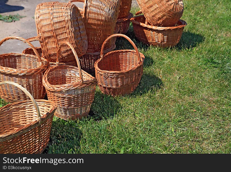 Brown baskets on green herb