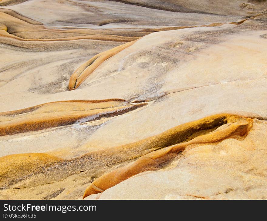 Sea smoothed rock forms interesting colors and textures