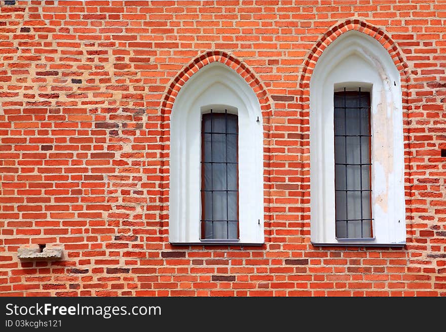 Window in red brick wall