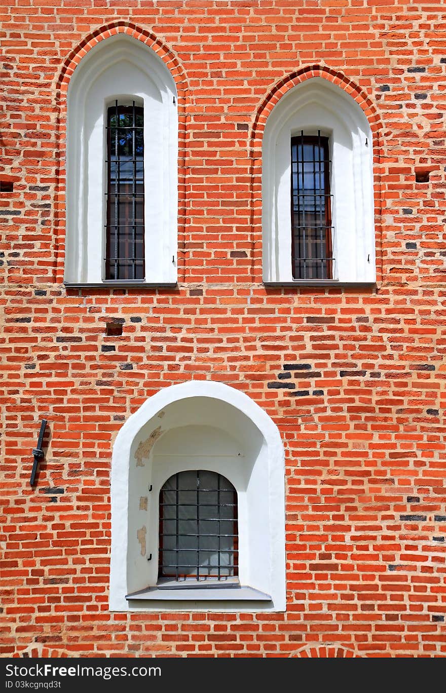 Window in red brick wall