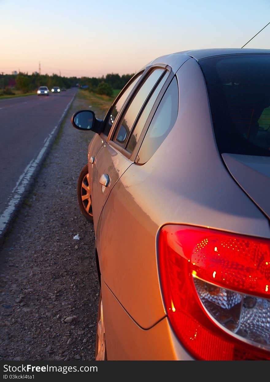 The car is on the side of the road summer. The car is on the side of the road summer