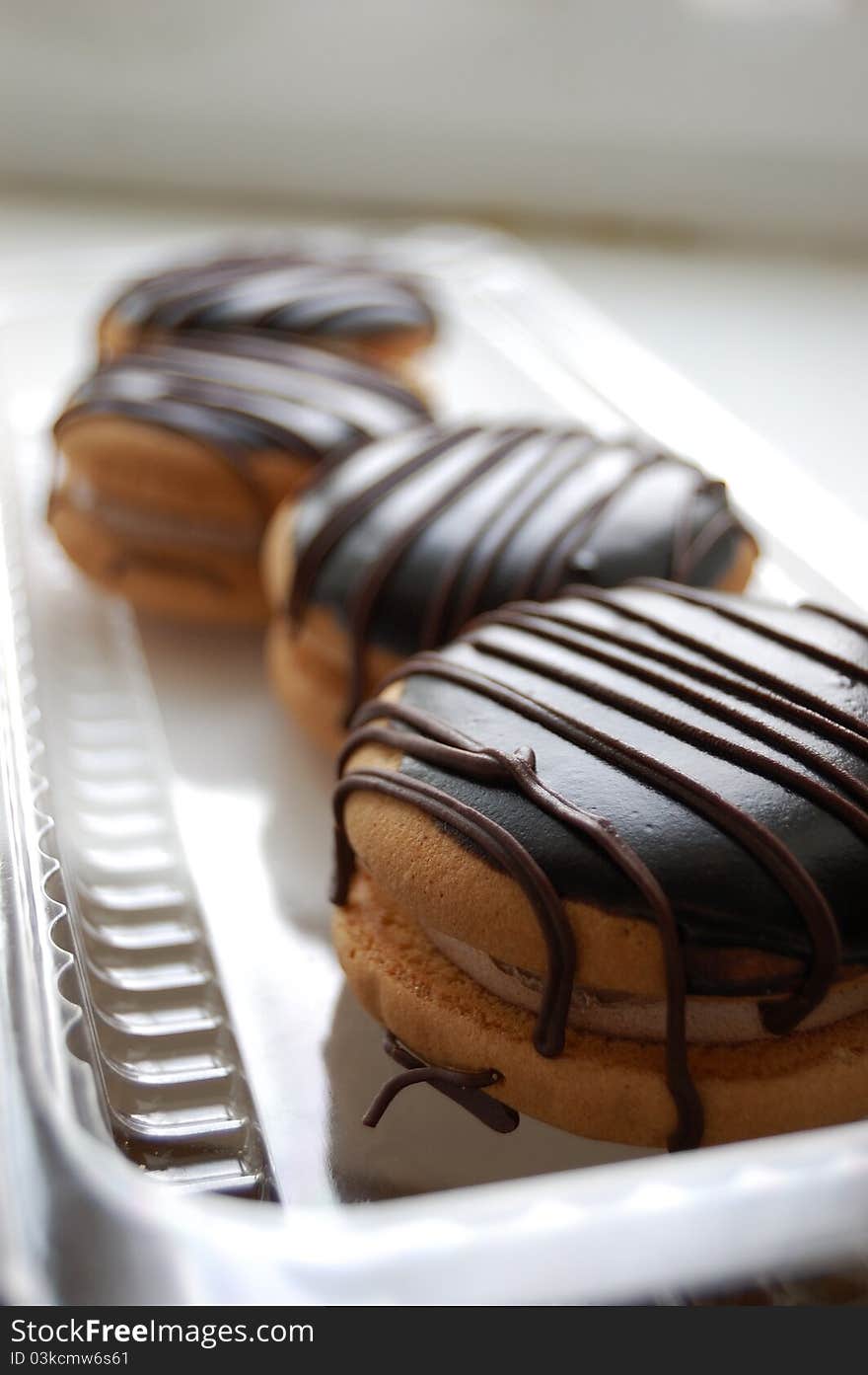 Four cakes with chocolate cream. Four cakes with chocolate cream