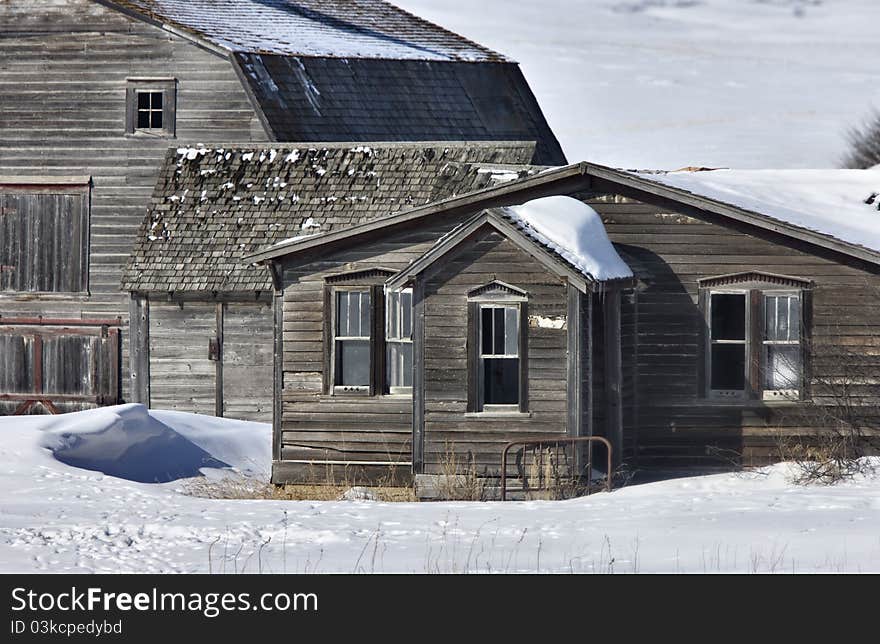 Old Granary and barn in winter Saskatchewan Canada