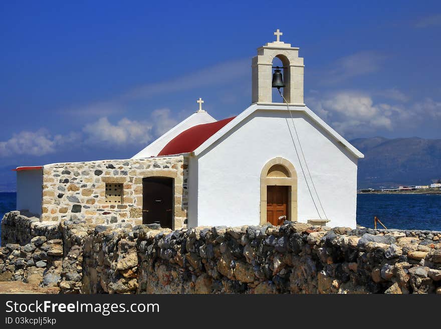 White greek chapel on the seashore. White greek chapel on the seashore