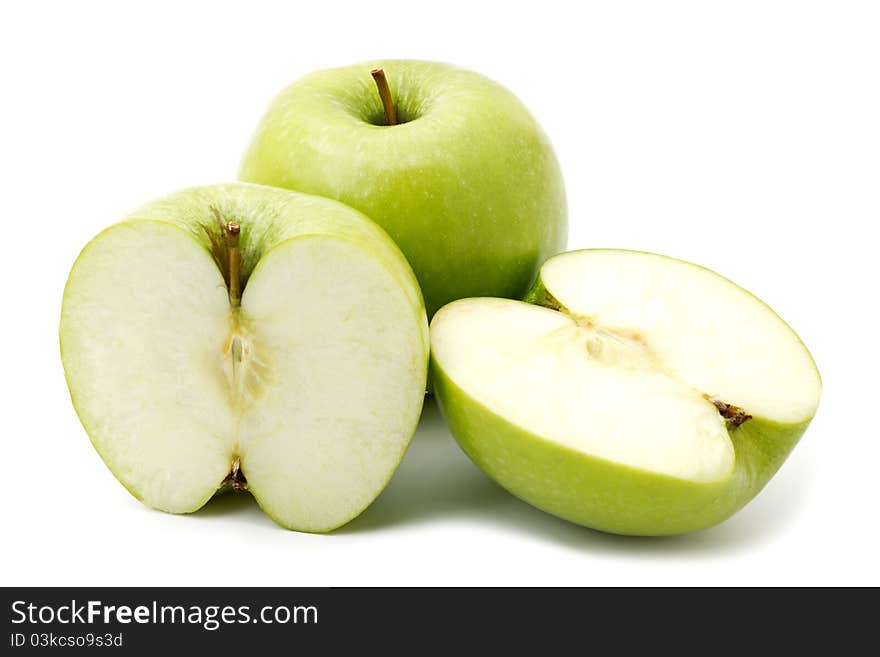 Green apple fruits and two halves of apple isolated on white background