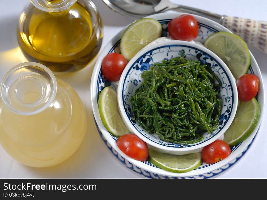 Boiled moss served with olive oil and lemon sauce. Boiled moss served with olive oil and lemon sauce