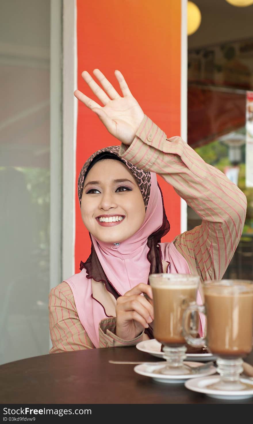 Beautiful Muslim Girl Waving To Her Friend