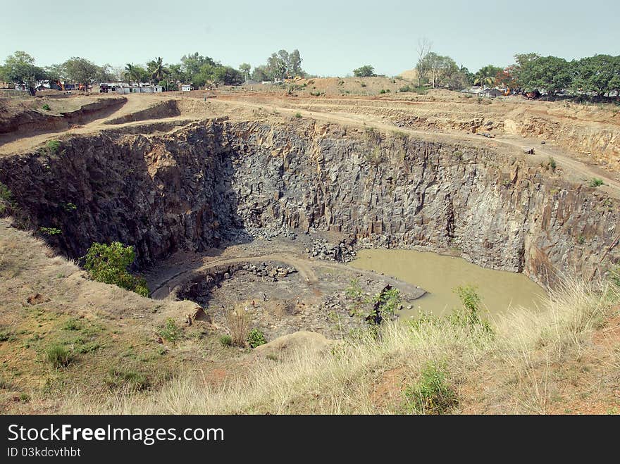 June 29,2011 Rampurhut,West Bengal,India,Asia-A horizontal view of a open cast mine. June 29,2011 Rampurhut,West Bengal,India,Asia-A horizontal view of a open cast mine.