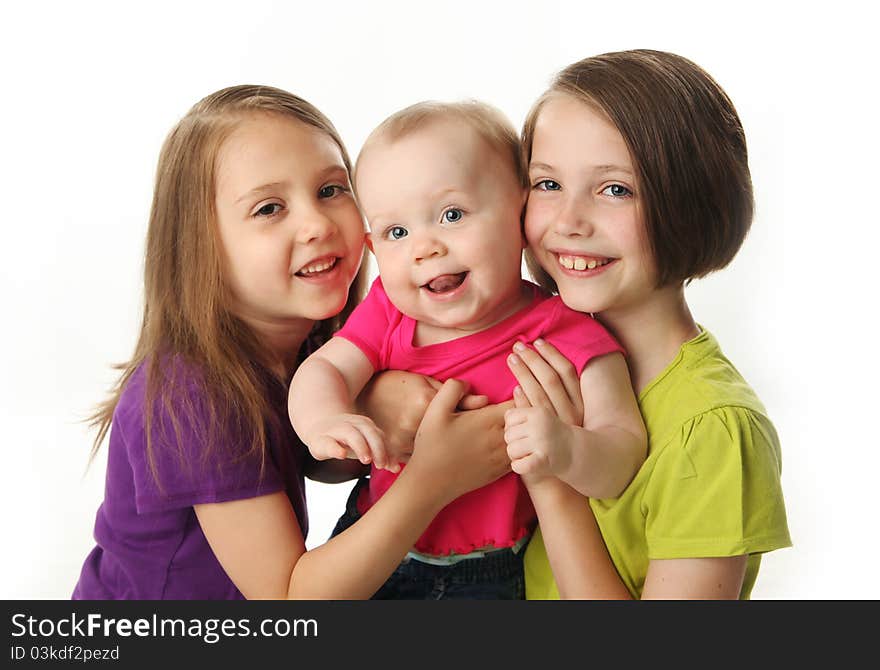 Three cute young sisters