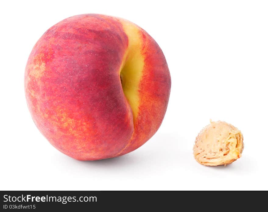 Peach and pit isolated on white background