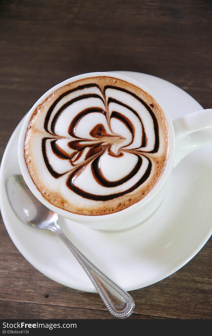 Cup Of Coffee On Wooden Table