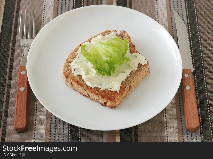 Toast with cream cheese on a plate