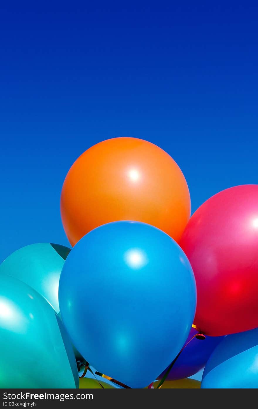 Bunch of colorful balloons in the blue sky