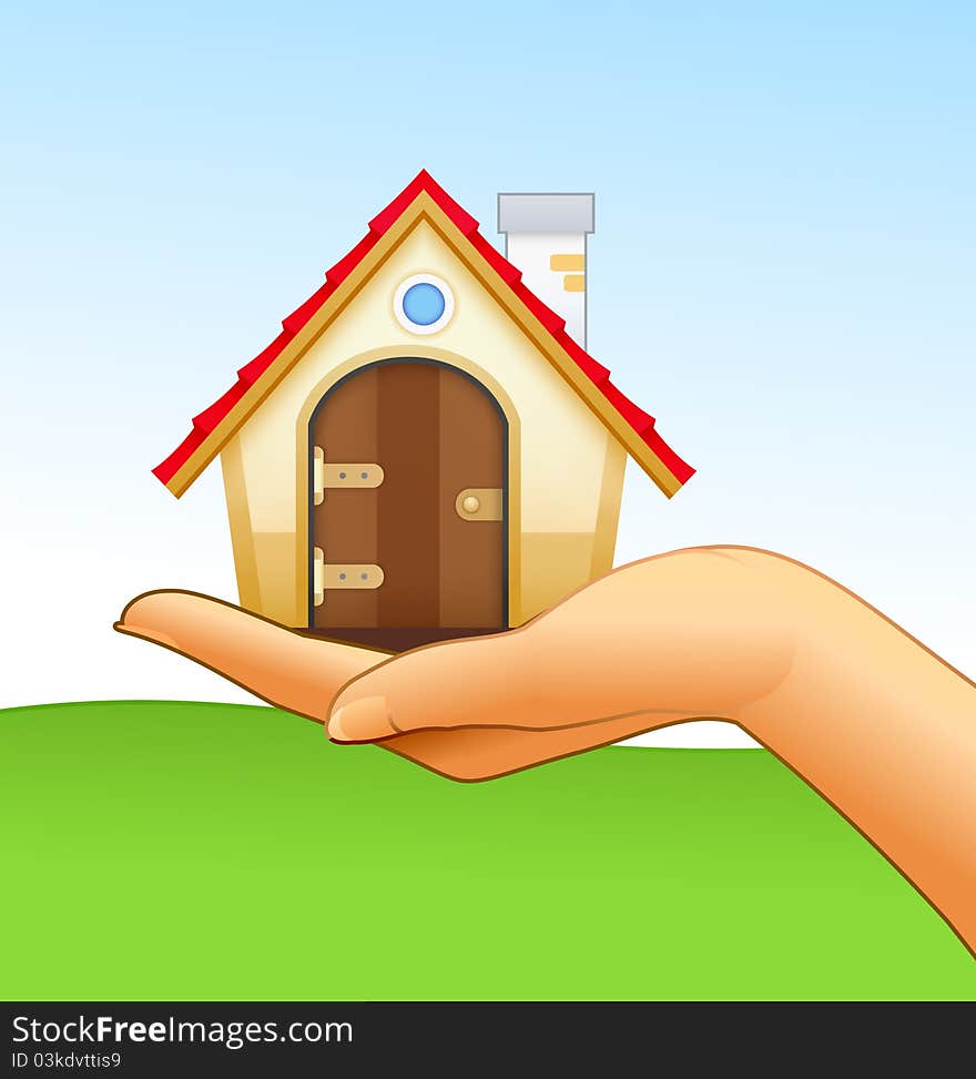 Woman’s hand is holding small house