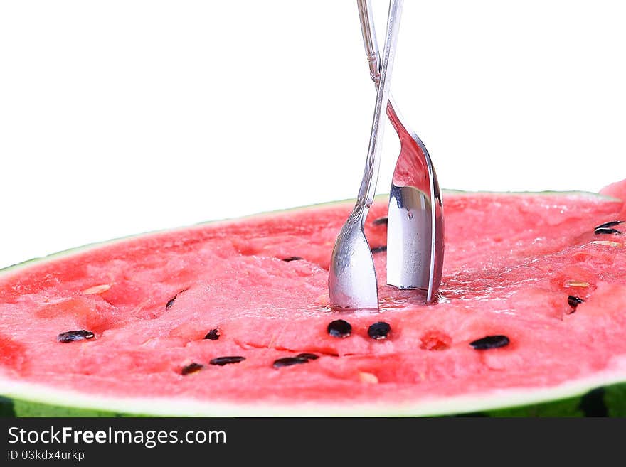 Watermelon with two scoops over white background