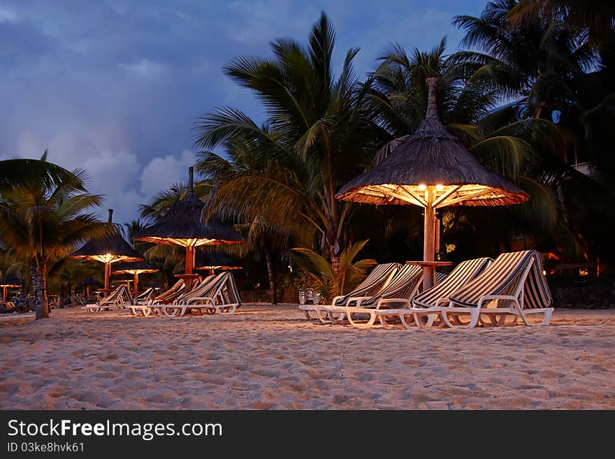 Beach huts on an island after sunset. Beach huts on an island after sunset