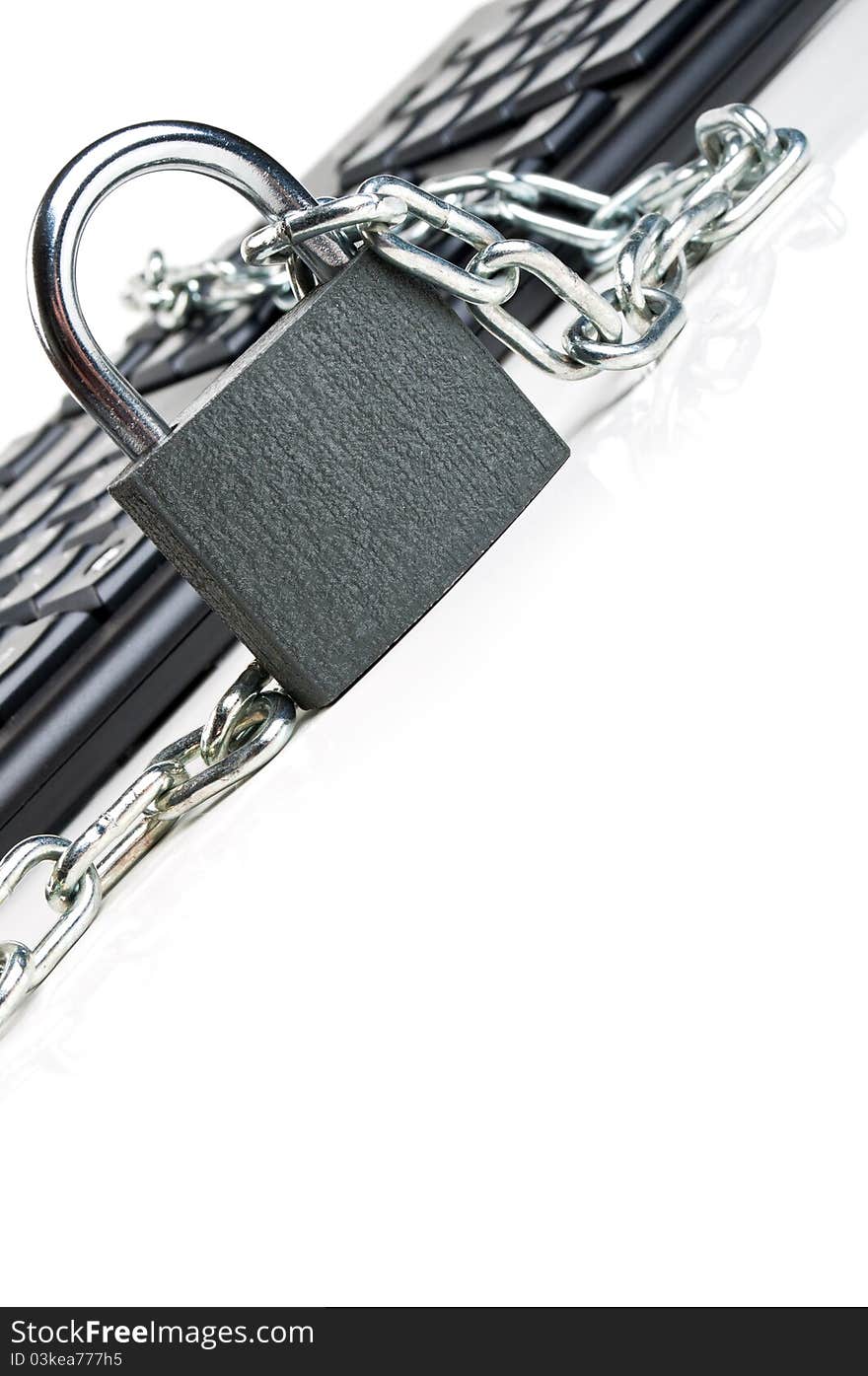 Computer keyboard and lock isolated on a white background