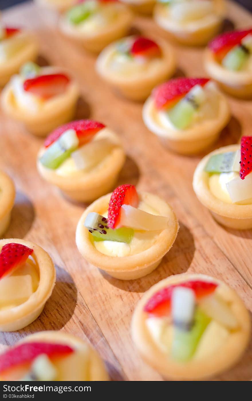 Beautiful strawberry pastry with fresh fruit.Very shallow depth of field. Beautiful strawberry pastry with fresh fruit.Very shallow depth of field.