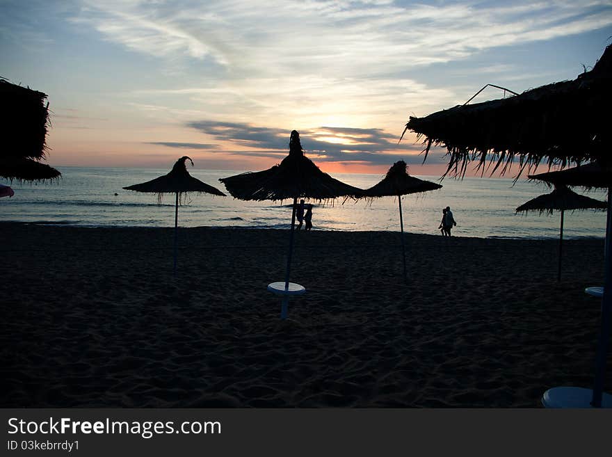 Walking on the beach against a beautiful sunset. Walking on the beach against a beautiful sunset