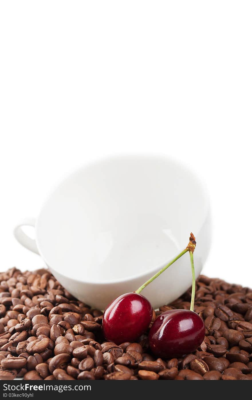 Cup with coffee beans and cherry isolated on a white background