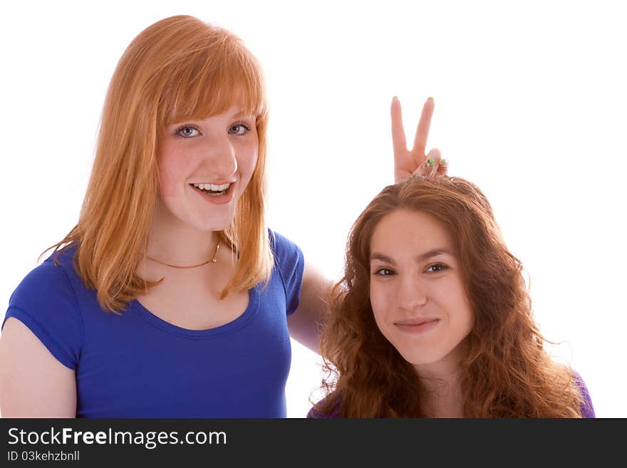 Two young girls are having fun in front of the camera. Two young girls are having fun in front of the camera