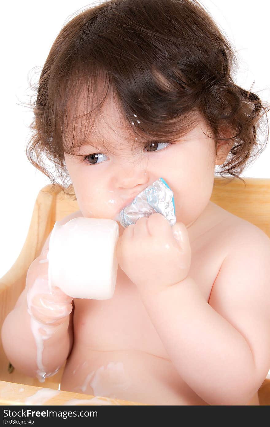 Baby enjoying a healthy snack. Baby enjoying a healthy snack