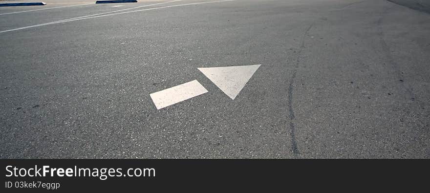 Directional arrow on the parking lot. Directional arrow on the parking lot.