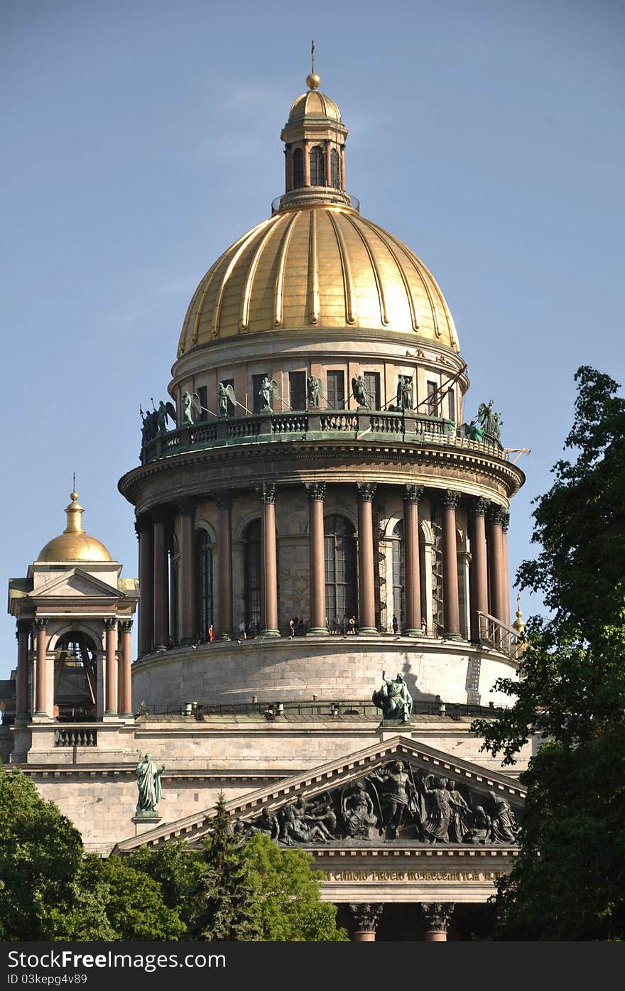 Sankt Petersburg landmark Isaac cathedral with columns and reliefs on a bright sunny day. Sankt Petersburg landmark Isaac cathedral with columns and reliefs on a bright sunny day