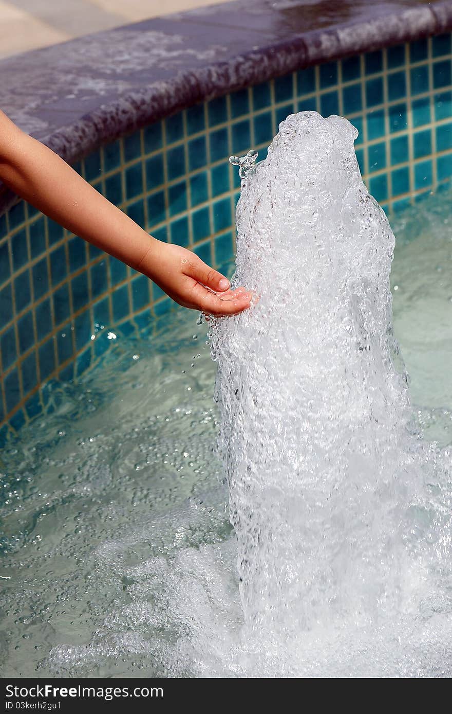 Child is playing the water. Child is playing the water