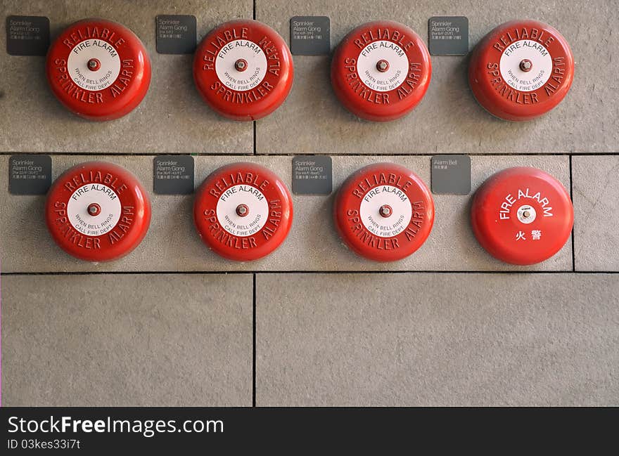 Red Alarms on brick wall