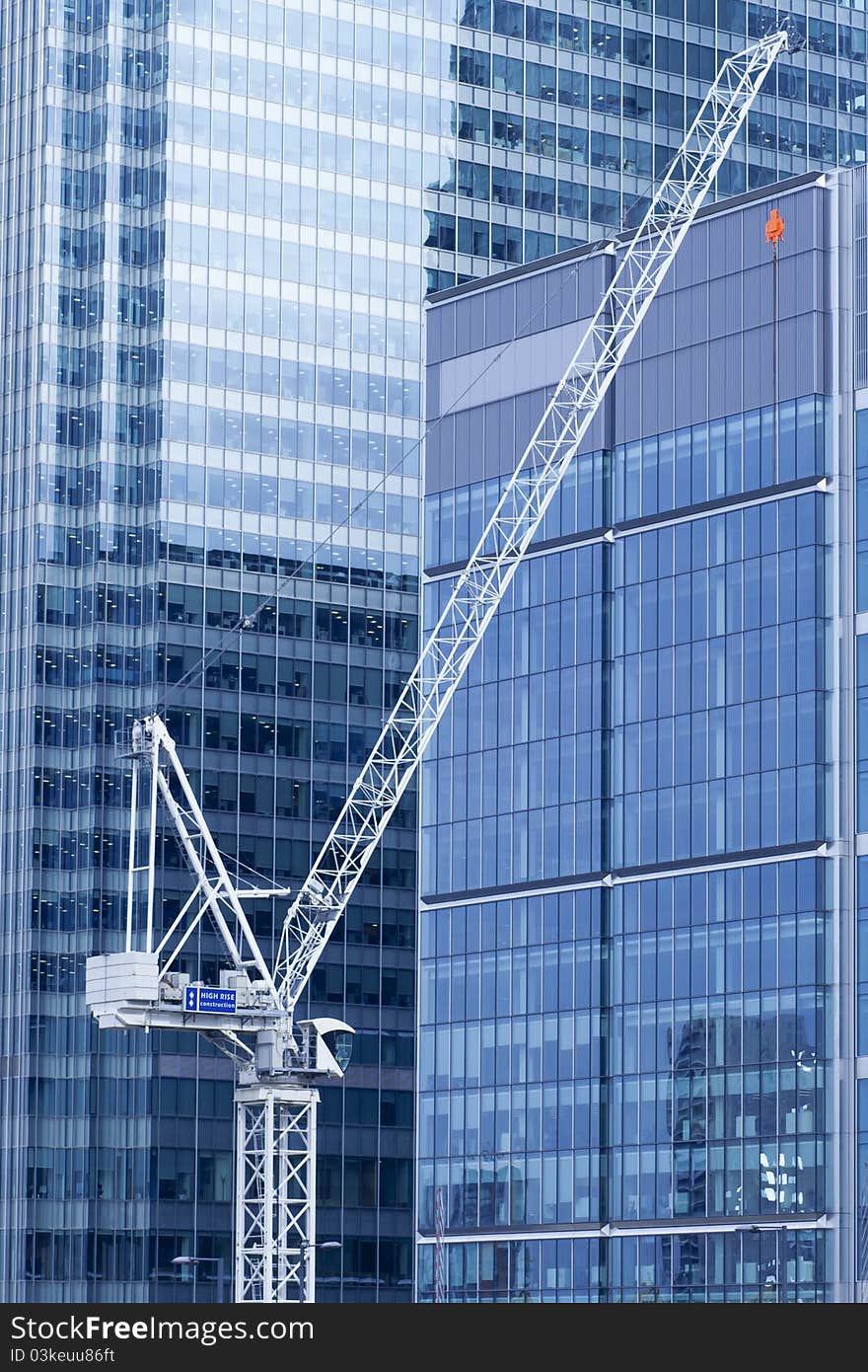 High rise tower block construction, downtown, inner city, with high tech glass walling.